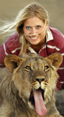 Long tongue lion cub with lovely lady