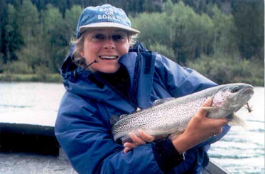 Cathy with Rainbow Trout Fish on Dry Fly at our Lodge!